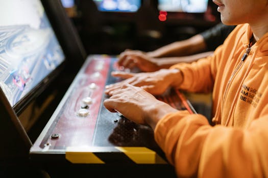 Player focused on winning at a retro arcade game